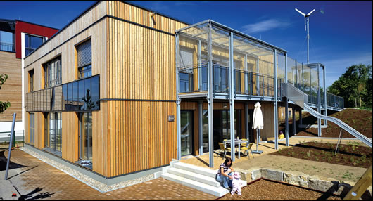 Both wind power and solar PV help to power the building Both wind power and solar PV help to power the building